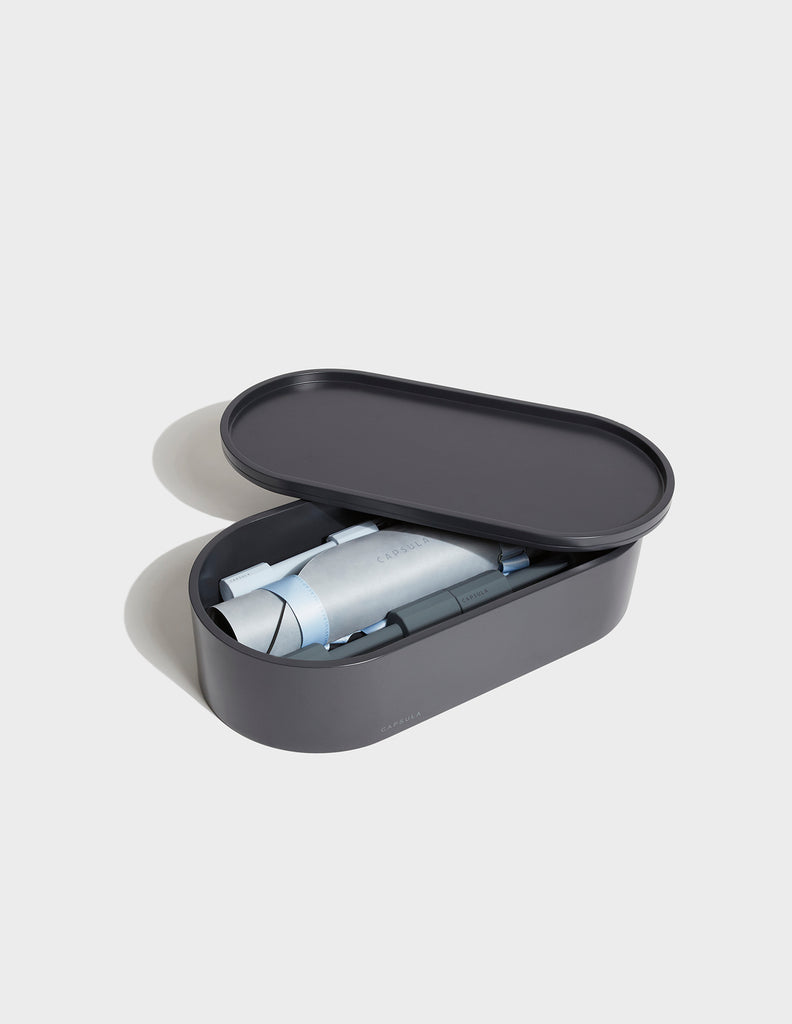 Blue grey Capsula Workout Kit which includes - storage, mat, resistance bands and dumbbells